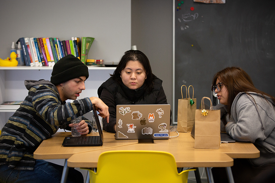 Students talk in group during first-year writing course.